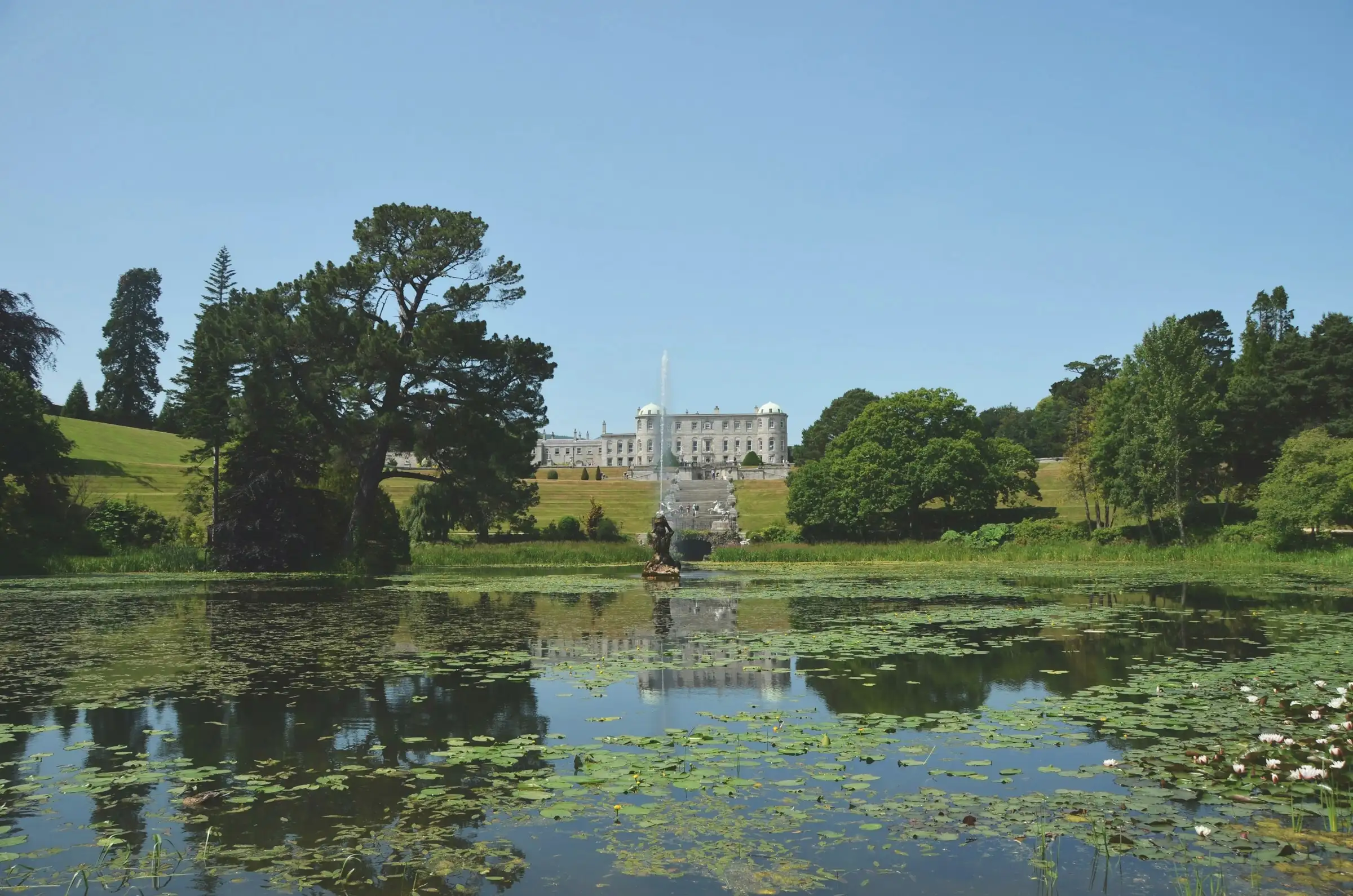 Powerscourt House above the Triton Lake and its gardens in County Wicklow